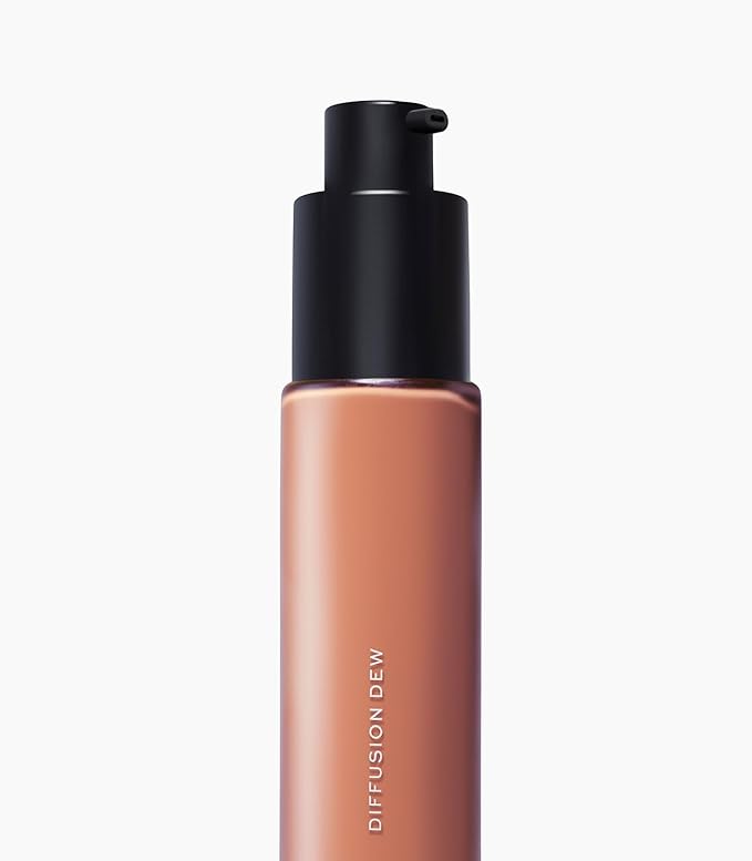 MAKE Beauty Diffusion Dew Skin Tint. Sheer to Medium Coverage Radiant Finish. Blurring, Smoothing, and Brightening for Glowing Complexion. Enhanced with Niacinamide and Adenosine. Hazelnut 16